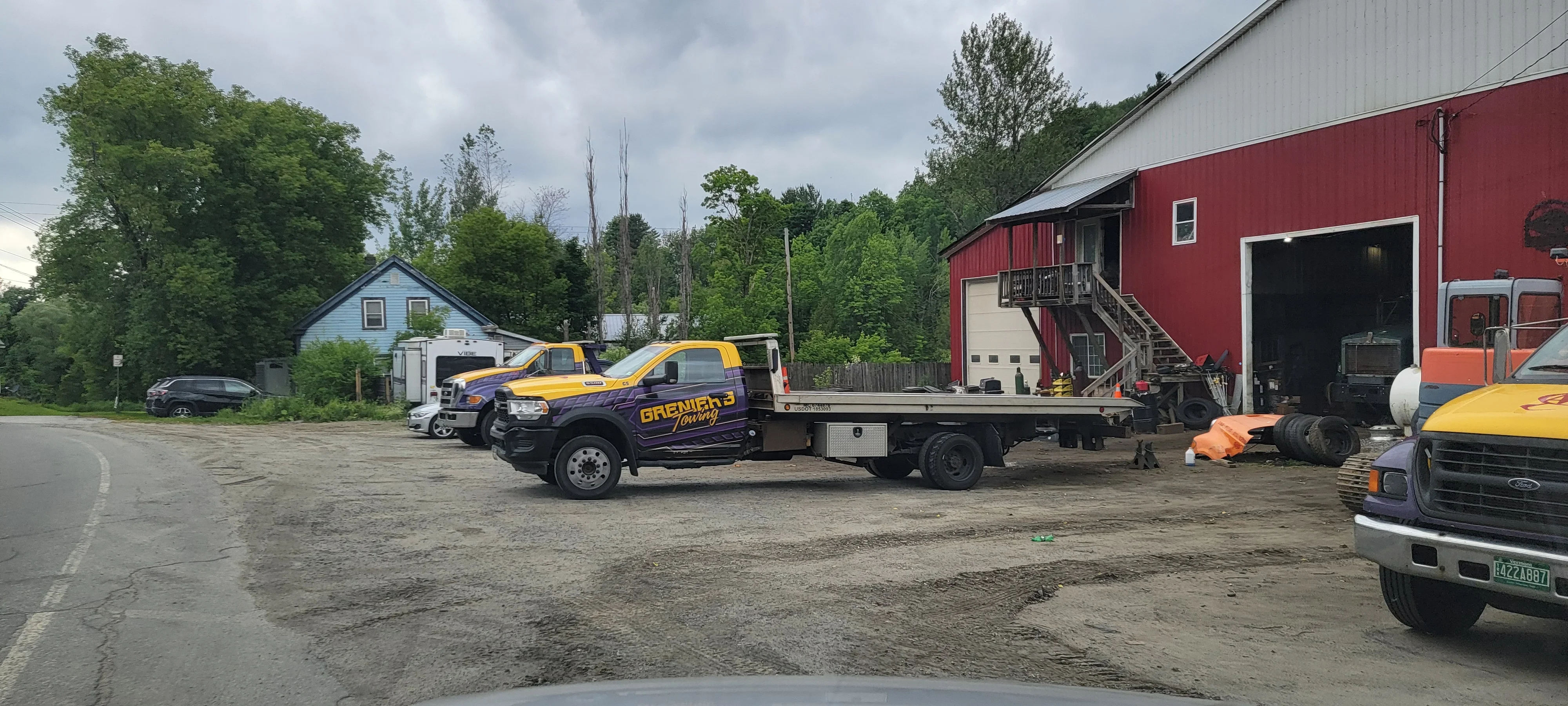 Flatbed Tow Trucks and Shop