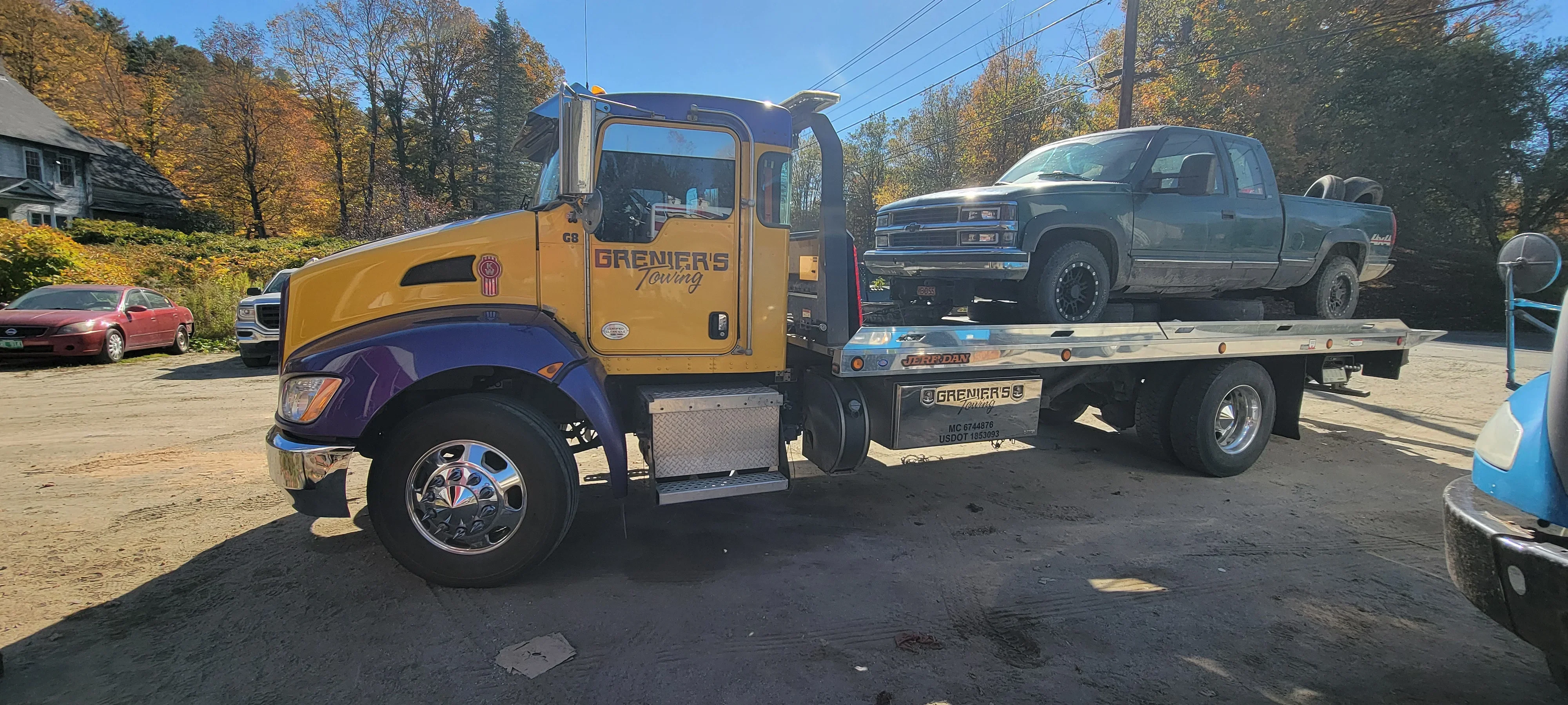 Tow Truck Transporting Pickup