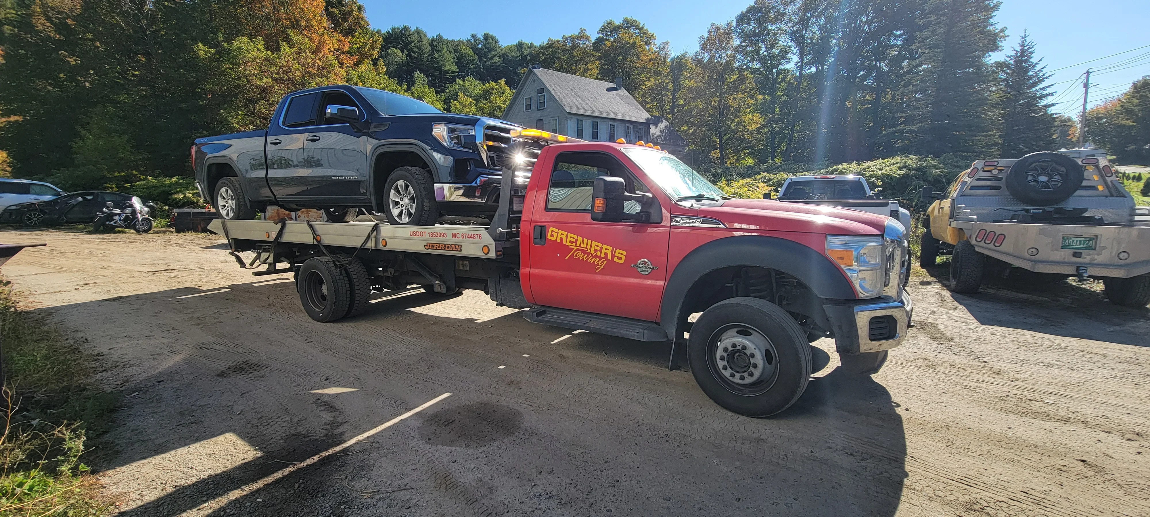 Flatbed Tow Truck Transporting Pickup
