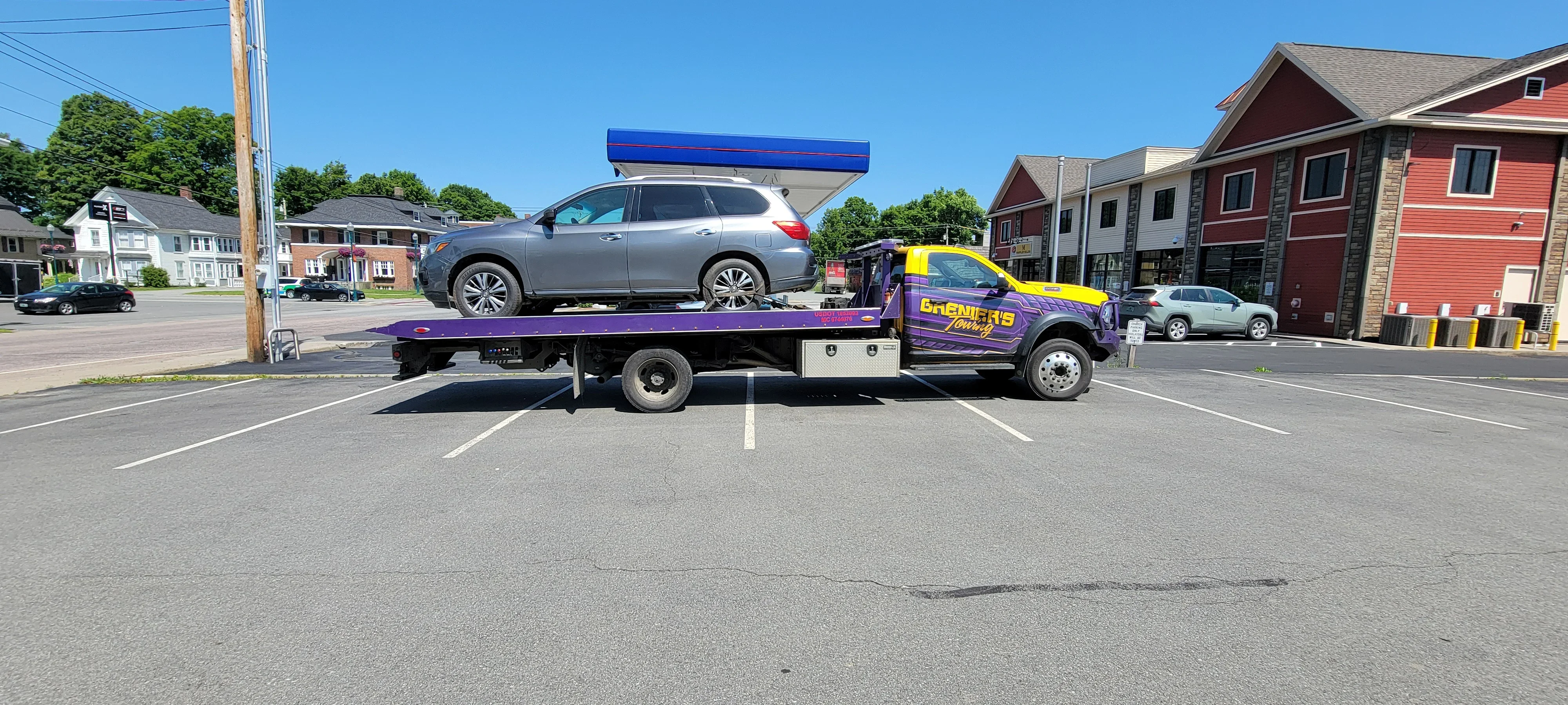 Flatbed Truck Towing SUV